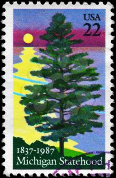 Royalty Free Photo of 1987 US Stamp Shows the White Pine, Michigan Statehood Sesquicentennial