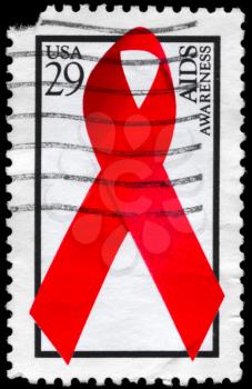 Royalty Free Photo of 1993 US Stamp Shows the Red Ribbon of AIDS Awareness