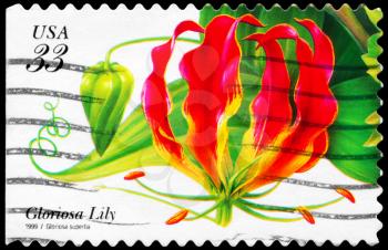 Royalty Free Photo of 1999 US Stamp Shows the Gloriosa Lily (Gloriosa Superba), Tropical Flowers