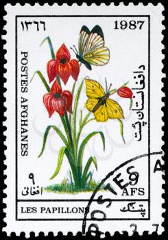 AFGHANISTAN - CIRCA 1987: A Stamp printed in AFGHANISTAN shows image of a Butterflies by Flower, series, circa 1987