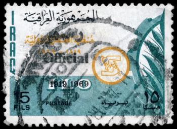 IRAQ - CIRCA 1969: A Stamp printed in IRAQ shows the ILO Emblem (50th 
anniv.), series, circa 1969