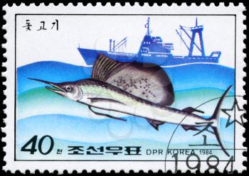 NORTH KOREA - CIRCA 1984: A Stamp printed in NORTH KOREA shows image of a Sailfish and Trawler from the series Fishing Industry, circa 1984
