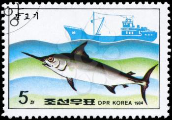 NORTH KOREA - CIRCA 1984: A Stamp printed in NORTH KOREA shows image of a Swordfish and Trawler from the series Fishing Industry, circa 1984