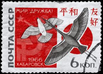 USSR - CIRCA 1966: A Stamp printed in USSR shows the Dove, Crane, Russian and Japanese Flags and devoted to Soviet-Japanese friendship, and 2nd meeting of Russian and Japanese delegates at Khabarovsk,