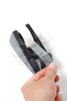 Royalty Free Photo of a Person Holding Tape