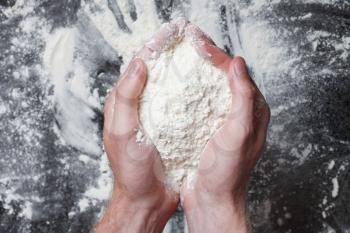 Royalty Free Photo of a Person Holding Flour