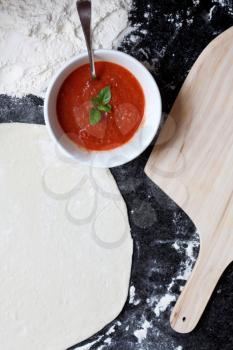 Royalty Free Photo of Pizza Dough and Sauce