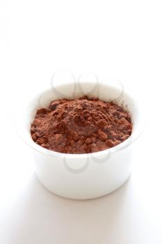 Royalty Free Photo of a Bowl of Cocoa Powder