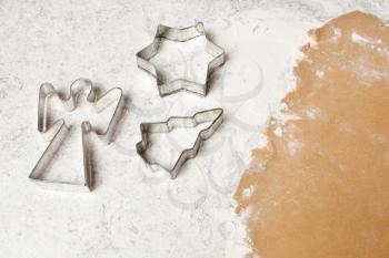 Royalty Free Photo of Cookie Cutters on Cookie Dough