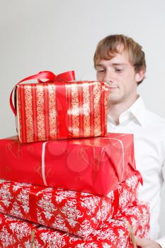 Royalty Free Photo of a Man Holding Presents