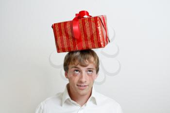 Royalty Free Photo of a Man Balancing a Present on His Head