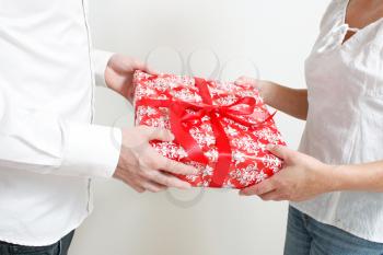Royalty Free Photo of a Man Giving a Woman a Present
