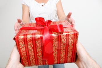 Royalty Free Photo of a Man Giving a Woman a Present