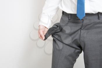 Royalty Free Photo of a Businessman Emptying His Pockets