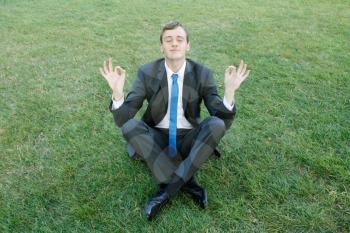 Royalty Free Photo of a Businessman Doing Yoga
