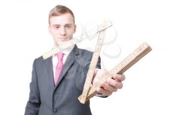 Royalty Free Photo of a Businessman Holding a Ruler