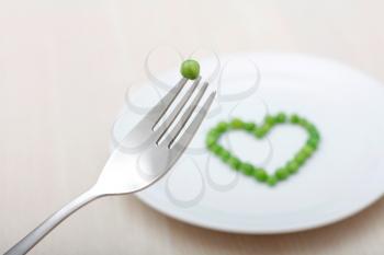 Royalty Free Photo of Heart Shape Peas on a Plate