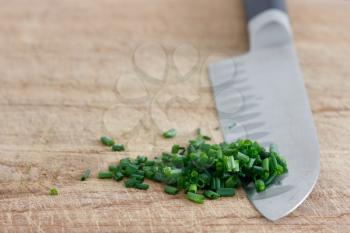 Royalty Free Photo of Chives on a Cutting Board