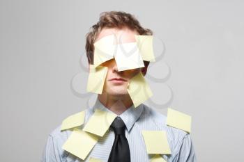 Royalty Free Photo of a Man Covered in Notes