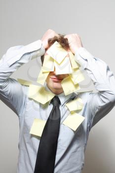 Royalty Free Photo of a Man Covered in Notes