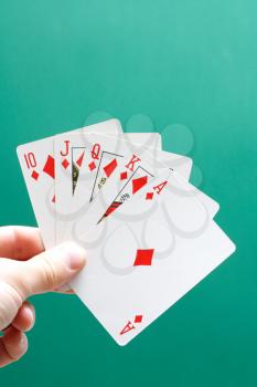 Royalty Free Photo of a Person Holding a Perfect Poker Hand