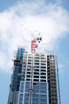 Royalty Free Photo of a Crane on a Building