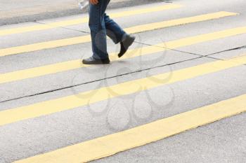 Royalty Free Photo of a Person Crossing the Street