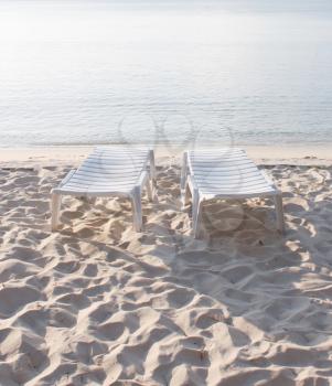 Royalty Free Photo of Chairs on a Beach