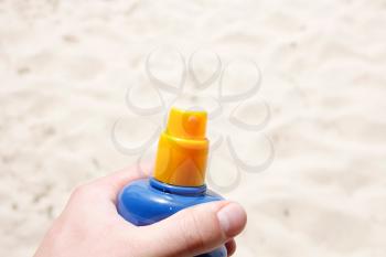 Royalty Free Photo of a Person Holding Sunscreen
