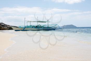Royalty Free Photo of a Boat on a Beach