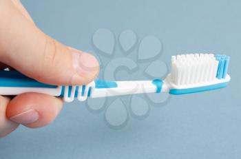 Royalty Free Photo of a Person Holding a Toothbrush