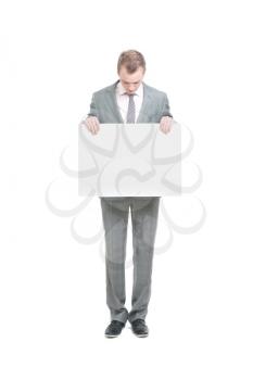 Royalty Free Photo of a Businessman Holding a Sign
