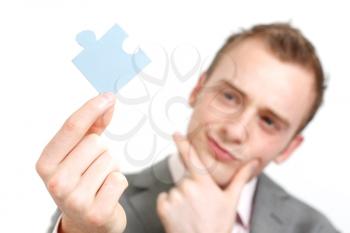 Royalty Free Photo of a Businessman Holding a Puzzle Piece