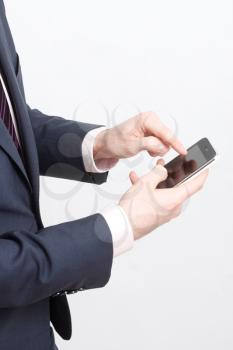 Royalty Free Photo of a Businessman Using a Cellphone