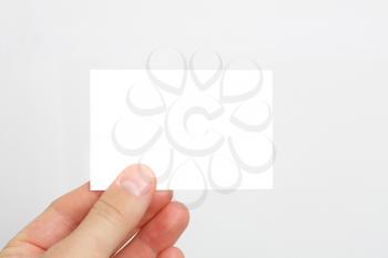 Royalty Free Photo of a Person Holding a Business Card