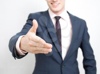 Royalty Free Photo of a Businessman Reaching for a Handshake