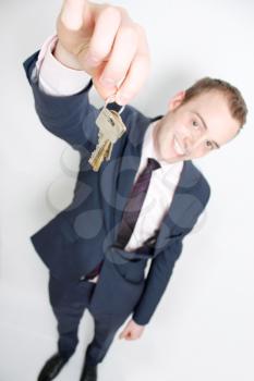 Royalty Free Photo of a Businessman Holding Keys