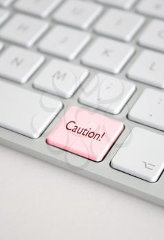 Royalty Free Photo of a Caution Button on a Keyboard