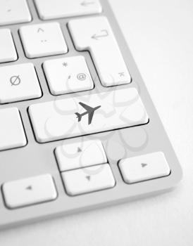 Royalty Free Photo of an Airplane Button on a Keyboard