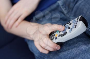 Royalty Free Photo of a Person Holding a Remote