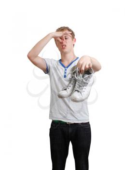 Royalty Free Photo of a Guy Holding Smelly Shoes
