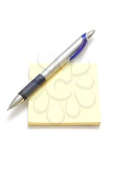 Royalty Free Photo of a Pen on a Note