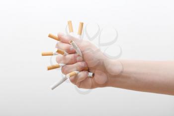 Royalty Free Photo of a Person Crushing Cigarettes