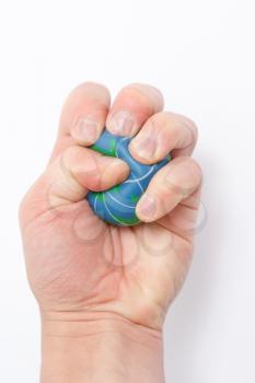 Royalty Free Photo of a Person Holding a Globe Stress Ball
