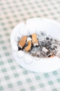 Royalty Free Photo of Cigarettes in an Ashtray