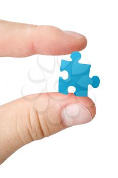 Royalty Free Photo of a Person Holding a Puzzle Piece