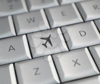 Royalty Free Photo of an Airplane on a Keyboard