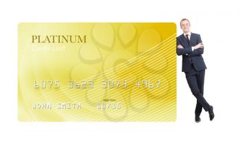 Royalty Free Photo of a Businessman Leaning on a Credit Card