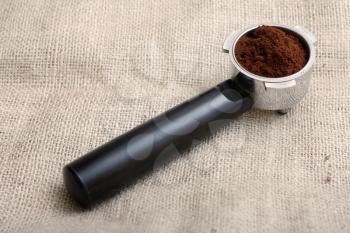 Royalty Free Photo of an Espresso Handle Filled With Coffee