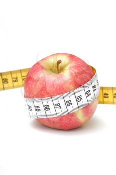 Royalty Free Photo of an Apple in Measuring Tape
